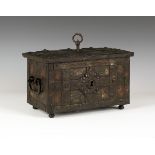 A small 17th/18th century Armada type wrought iron chest with typical elaborate locking mechanism,