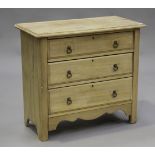 An early 20th century stripped pine chest of three long drawers, on stile supports, height 82cm,