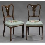 A pair of Edwardian rosewood and foliate inlaid side chairs, the pierced splat backs above