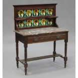 An Edwardian walnut and rouge marble topped washstand with tiled back, fitted with a frieze