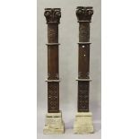 A pair of late 19th/early 20th century carved teak architectural columns, both decorated in relief