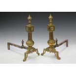 A pair of late Victorian cast brass andirons, the front uprights with turned finials and