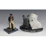 A mid-20th century Black & White Scotch Whisky moulded rubber advertising figure, height 20cm, width