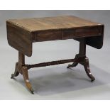 A Regency rosewood sofa table, the hinged top above two frieze drawers, on block supports and