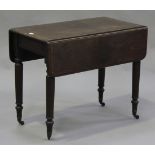 A mid-Victorian mahogany Pembroke table, fitted with a single drawer, on turned legs with brass