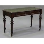 A Victorian mahogany writing table, the moulded top inset with a green leather writing surface above