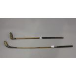 A hickory-shafted long-nose golf club with lead back weight and brass base plate, impressed 'T.