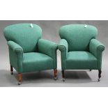 A pair of early 20th century scroll armchairs, upholstered in green foliate patterned fabric, on