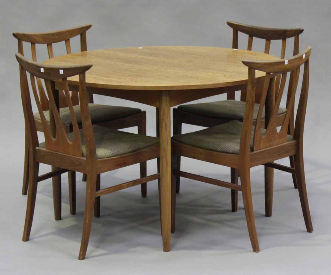 A mid-20th century G-Plan teak dining room suite, comprising a sideboard, height 79cm, width