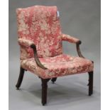 A George III mahogany Gainsborough armchair with overall later carved blind fretwork decoration, the