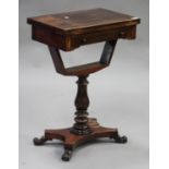 A Regency rosewood fold-over games table, the hinged top revealing an inlaid chessboard above a