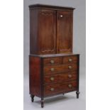 A George III mahogany bookcase cabinet-on-chest with overall boxwood line inlaid borders, the