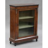 A mid-Victorian burr walnut and ebonized pier cabinet with applied gilt metal mounts, enclosed by