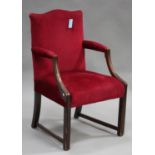 A 20th century George III style mahogany armchair, upholstered in red velour, on block legs,