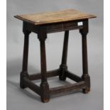 A 17th century and later oak joint stool, the later rectangular top raised on turned and block