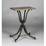 A Regency ebonized wine table, the curved rectangular top painted in a trompe l'oeil effect with