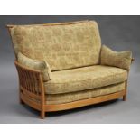 An Ercol Renaissance pattern elm framed three-piece suite, upholstered in patterned fabric, width of