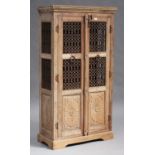 A late 20th century Indian hardwood side cabinet, fitted with a pair of doors inset with metal