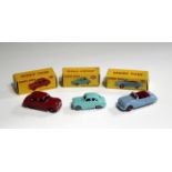 Three Dinky Toys cars, comprising a No. 106 Austin Atlantic, finished in light blue, a No. 160