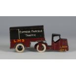 A pre-war Dinky Toys No. 33a and No. 33r mechanical horse and trailer, finished in LMS maroon and