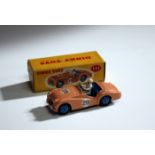 A Dinky Toys No. 111 Triumph TR2 Sports, finished in pink with race number 29, boxed with colour