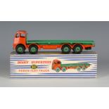 A Dinky Supertoys No. 902 Foden flat truck, finished in green and orange, within a blue and white