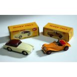 A Dinky Toys No. 102 M.G. Midget Sports, finished in yellow, and a No. 167 A.C. Aceca coupé,