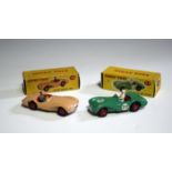 A Dinky Toys No. 104 Aston Martin DB3S, finished in pink, and a No. 110 Aston Martin DB3 Sports,