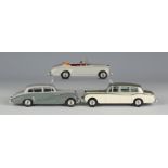 Three Dinky Toys cars, comprising a No. 150 Rolls-Royce Silver Wraith, a No. 194 Bentley coupé and a