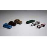 Six Dinky Toys cars, comprising a post-war No. 23a racing car, a No. 23e Speed of the Wind car, a