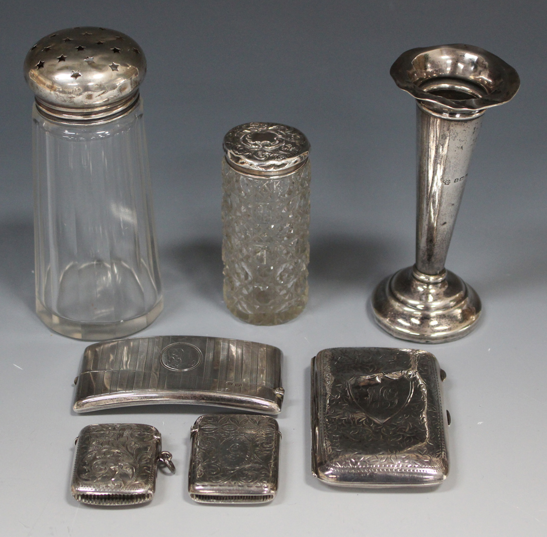 A small group of silver items, comprising two vesta cases with foliate engraved decoration,