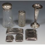 A small group of silver items, comprising two vesta cases with foliate engraved decoration,