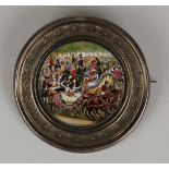 A Victorian silver framed enamel circular brooch, the central panel painted with a horse drawn