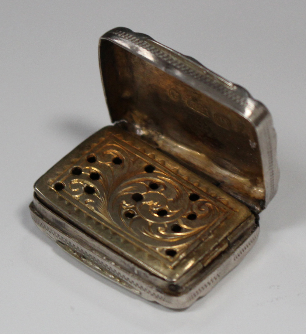 A Victorian silver vinaigrette of rectangular form with engraved scroll decoration, the hinged lid - Image 2 of 5