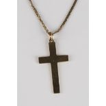 A gold pendant cross, detailed '9ct', on a 9ct gold neckchain, five pairs of mostly gold earrings,