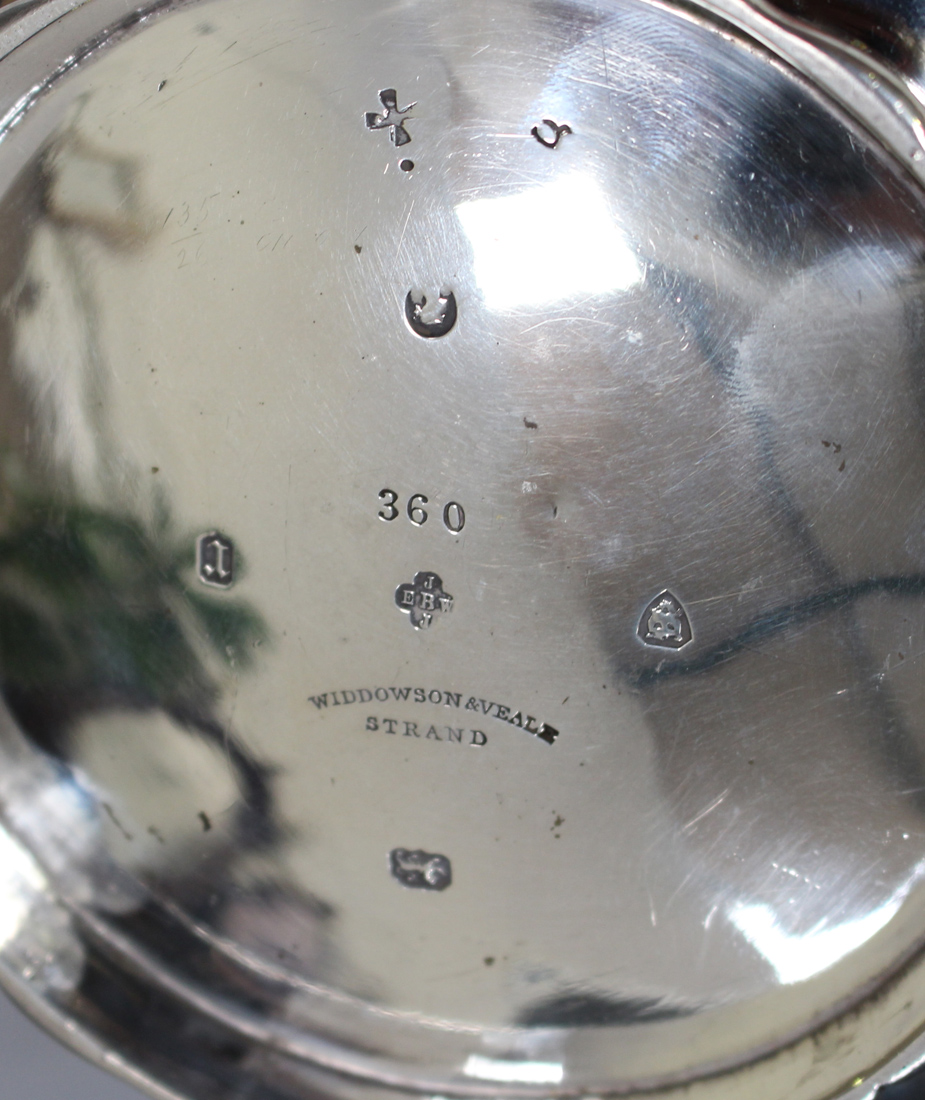 A Victorian silver teapot of shaped circular form, engraved with foliate scroll borders and opposing - Image 2 of 2