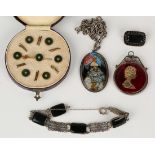 A set of six gilt metal, green enamel and colourless paste dress studs and matching brooch, cased,