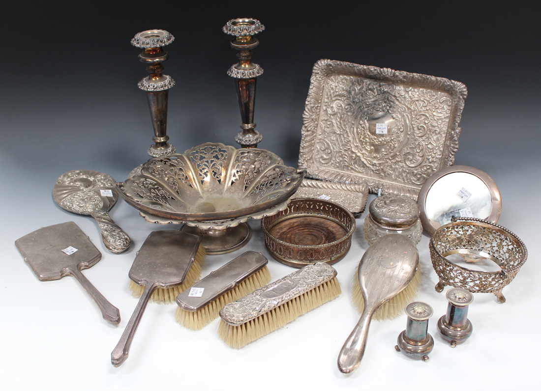 An Edwardian silver rectangular dressing table tray with embossed foliate scroll decoration,