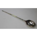 A mid-18th century silver mote spoon with tapered handle and pyramid terminal, the bowl pierced with