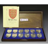 A set of twelve silver 'The Royal Arms' shield shaped ingots, commemorating Queen Elizabeth II