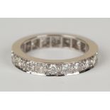 An 18ct white gold and diamond eternity ring, mounted with circular cut diamonds, ring size approx