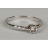 An 18ct white gold and diamond single stone ring, claw set with a circular cut diamond, detailed '