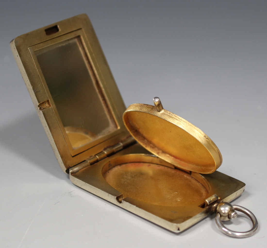 A George V silver gilt and lilac enamel rectangular compact, hinged to reveal a mirror and oval - Image 4 of 5
