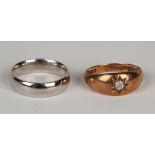 A 22ct gold plain wedding ring (subsequently rhodium plated), London 1917, ring size approx L, and a