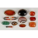 A collection of ten mostly agate set brooches in a variety of designs and a small seal with an agate