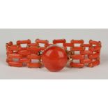 A Victorian gold mounted coral bracelet in a bar link design, on a circular snap clasp, mounted with