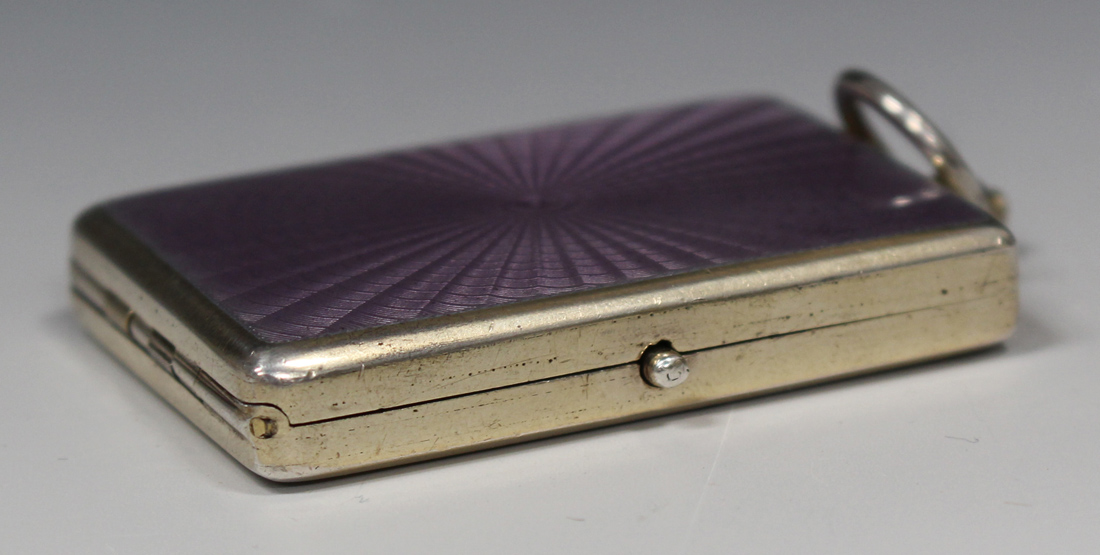 A George V silver gilt and lilac enamel rectangular compact, hinged to reveal a mirror and oval - Image 3 of 5