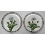 A pair of Danish sterling and enamelled circular pin dishes, each interior decorated with a stem