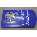 A 'Peugeot Motorcycles' painted aluminium advertising sign, finished in blue and white with raised