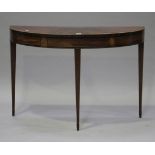 A George III mahogany demi-lune side table with crossbanded and line inlaid decoration, raised on